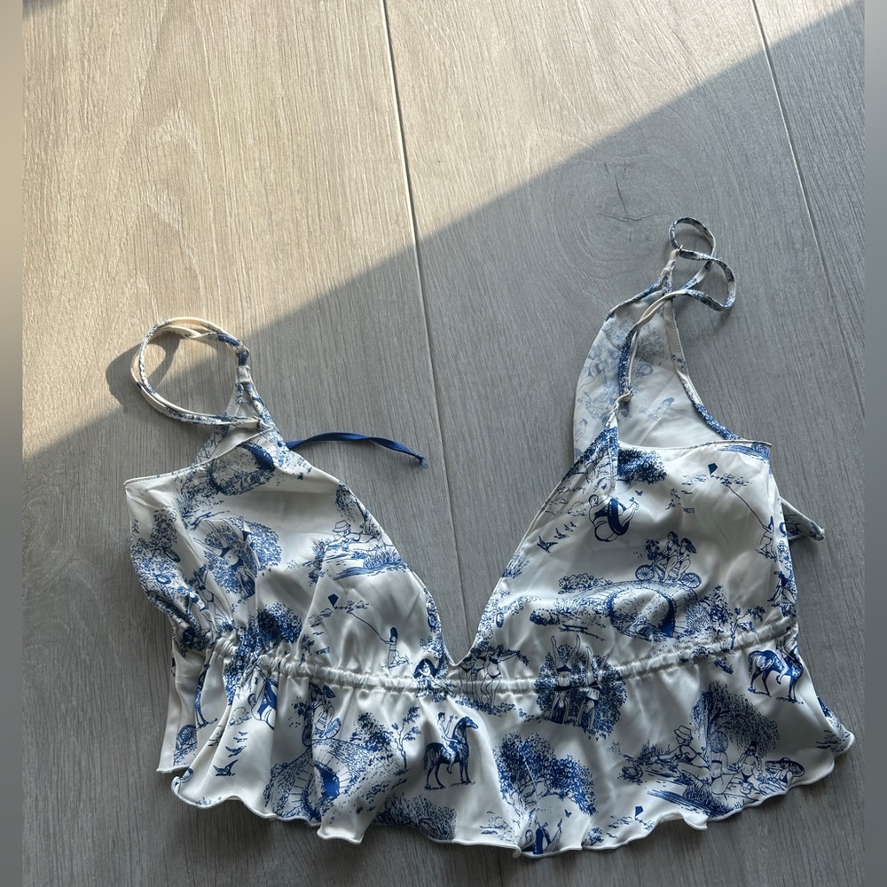 Parade whimsical pattern blue white deep v tie back top